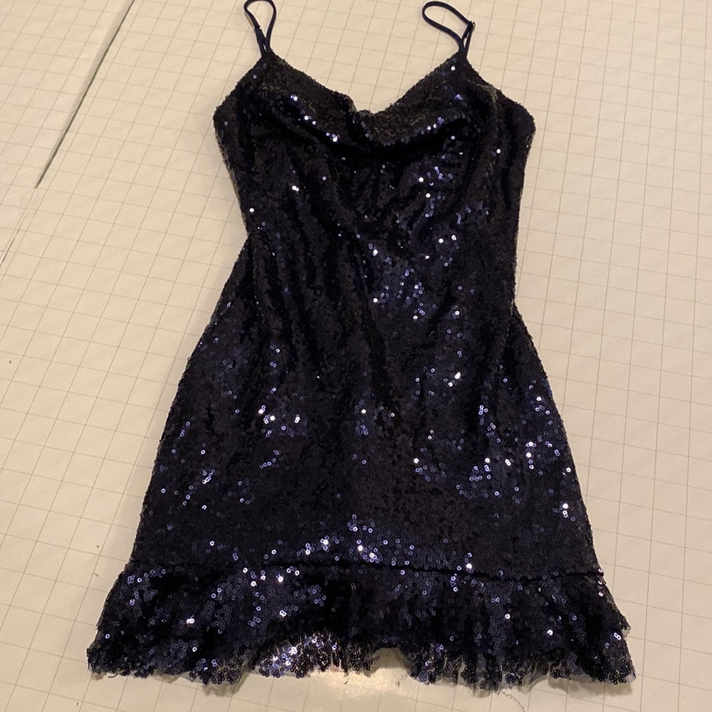 Dark blue sequined mini-dress with ruffles on the skirt